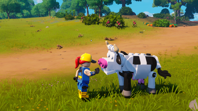Un joueur caressant une vache dans LEGO Fortnite.